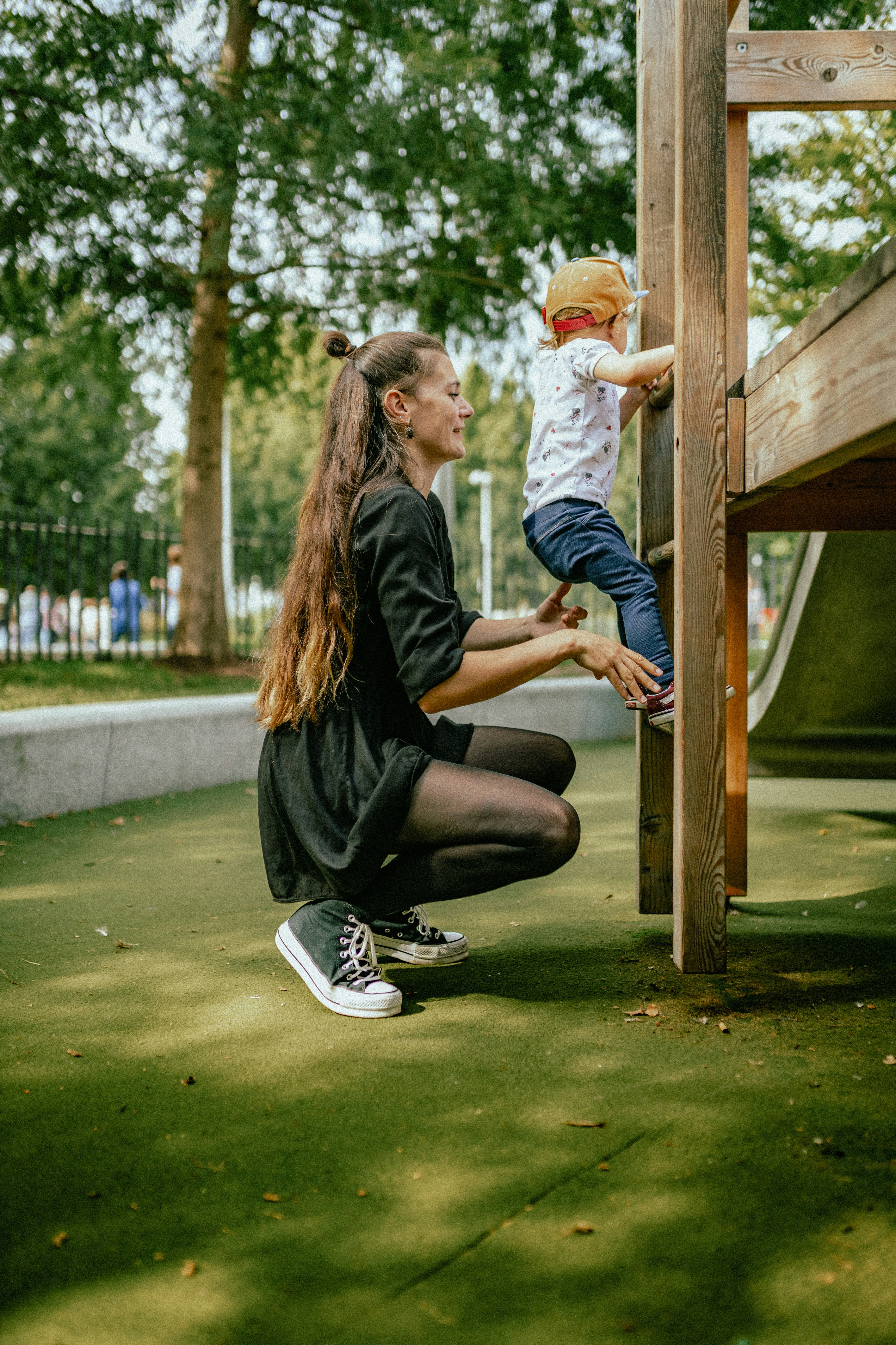 Bloom educator supporting a child on the playground